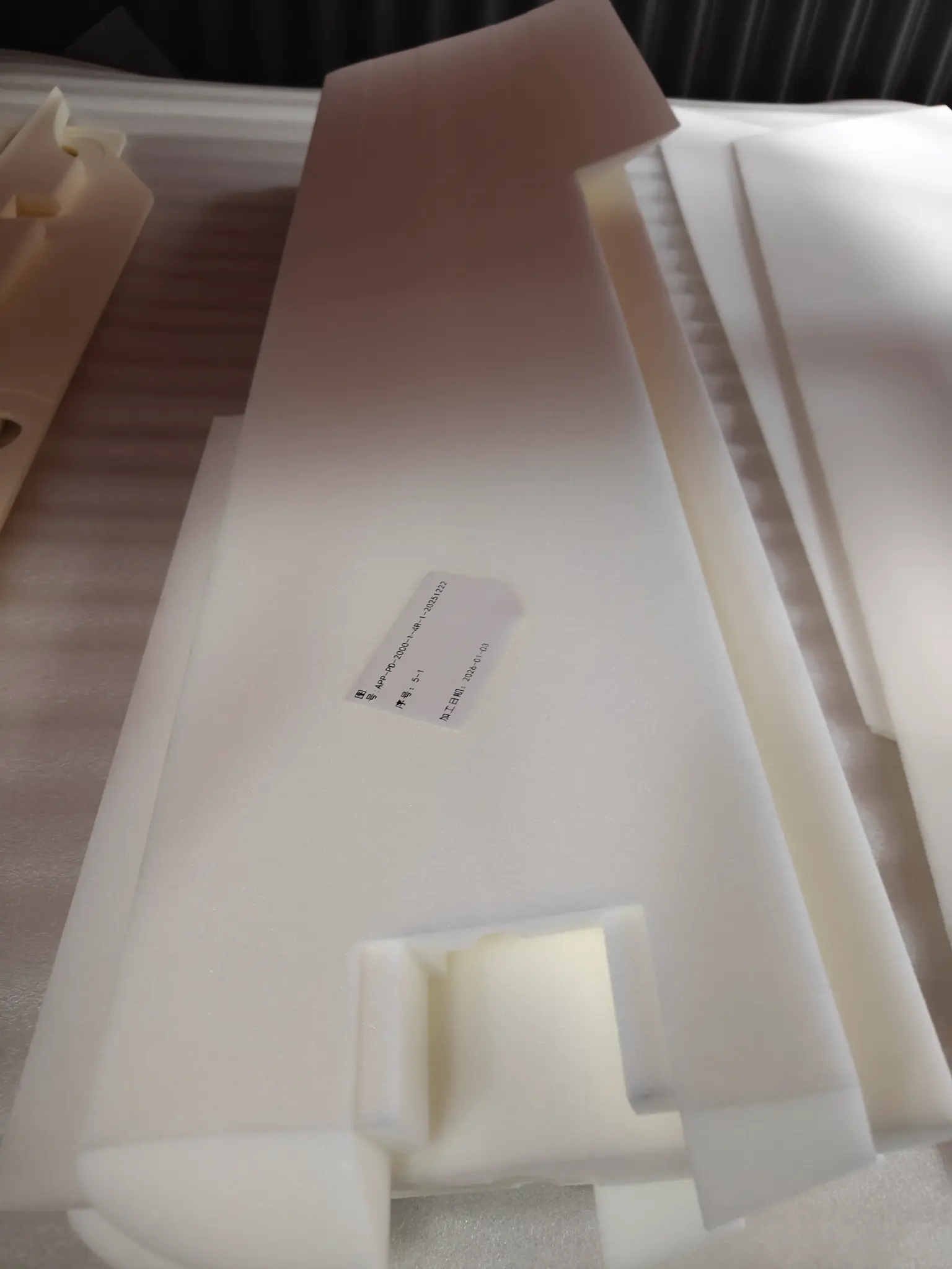 White PMI foam core panel with a machined rectangular feature